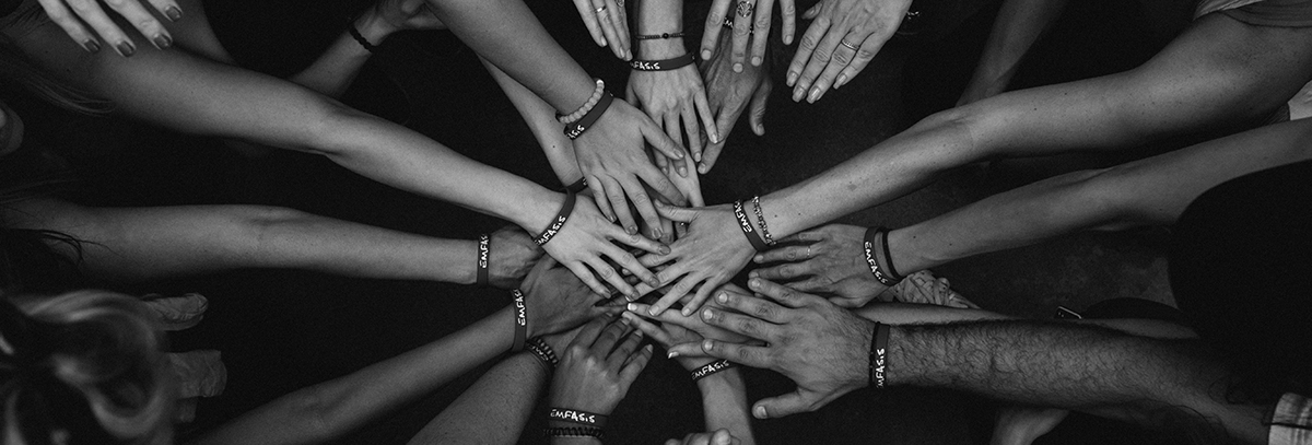 a circle of hands on top of each other 
